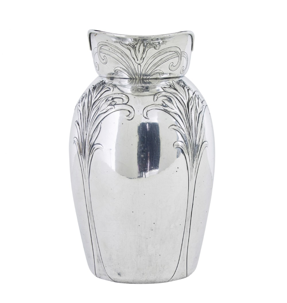 An Art Nouveau silver-plated ewer jug and matching basin set made by Christofle featuring relief-carved botanical foliage details. View III