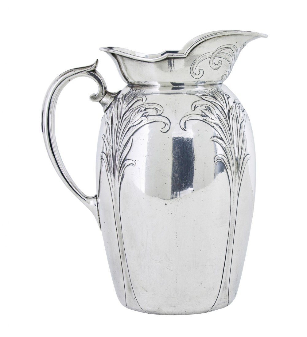 An Art Nouveau silver-plated ewer jug and matching basin set made by Christofle featuring relief-carved botanical foliage details. View IV
