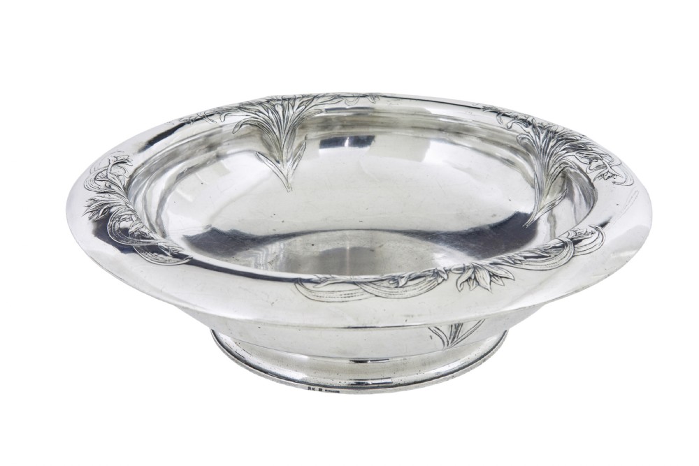 An Art Nouveau silver-plated ewer jug and matching basin set made by Christofle featuring relief-carved botanical foliage details. View IX