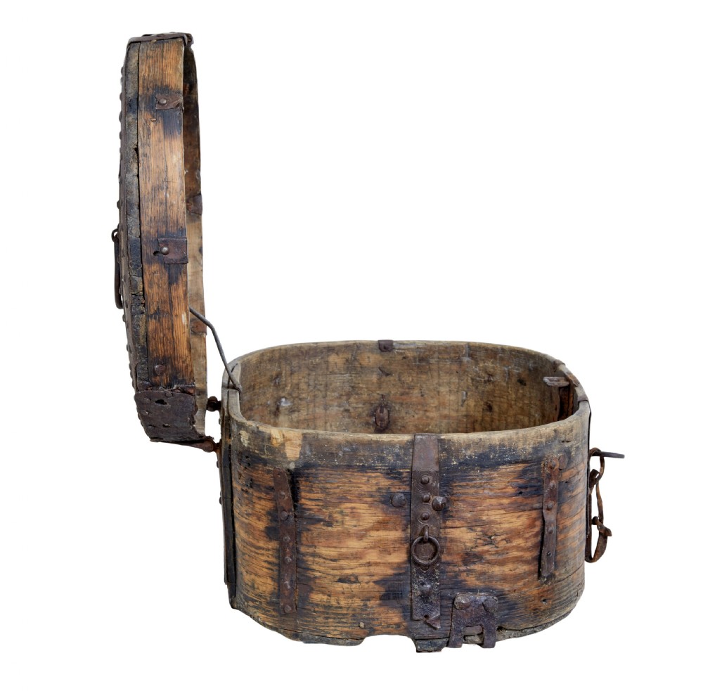 An early 18th-century Scandinavian oval oak box featuring wrought iron binding straps, studded rivets, and carved initials on the top. View II