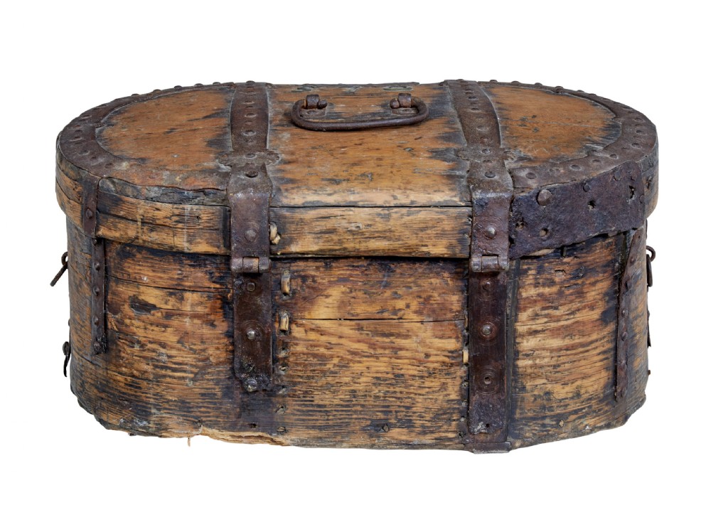 An early 18th-century Scandinavian oval oak box featuring wrought iron binding straps, studded rivets, and carved initials on the top. View III