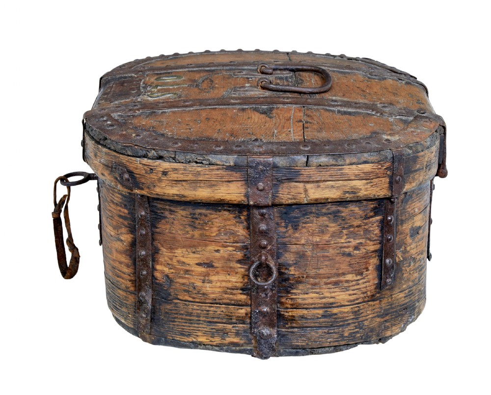An early 18th-century Scandinavian oval oak box featuring wrought iron binding straps, studded rivets, and carved initials on the top. View IV