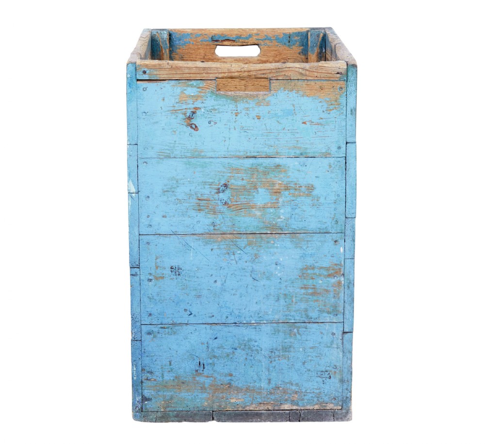 A rectangular 19th century Swedish pine log box featuring distressed blue paint on the sides and exposed natural timber grain on the front. View II