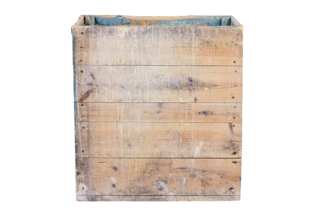 A rectangular 19th century Swedish pine log box featuring distressed blue paint on the sides and exposed natural timber grain on the front. View III