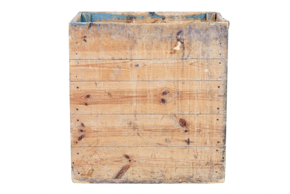 A rectangular 19th century Swedish pine log box featuring distressed blue paint on the sides and exposed natural timber grain on the front. View V