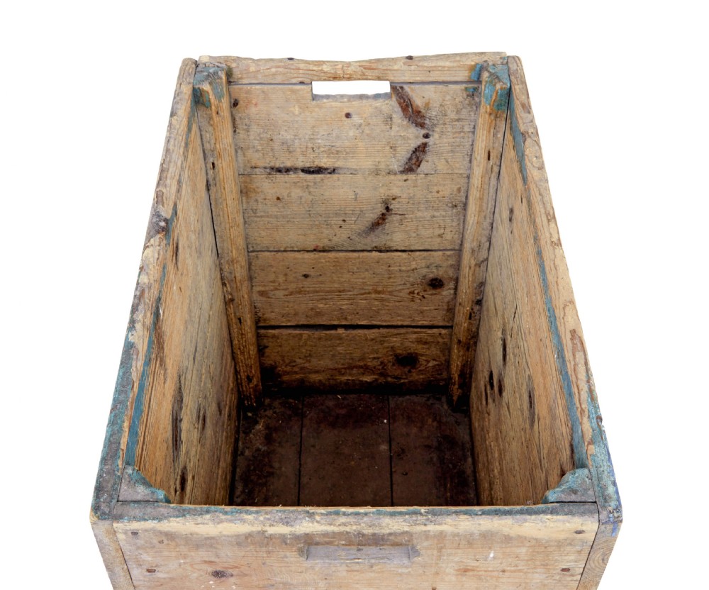 A rectangular 19th century Swedish pine log box featuring distressed blue paint on the sides and exposed natural timber grain on the front. View VI