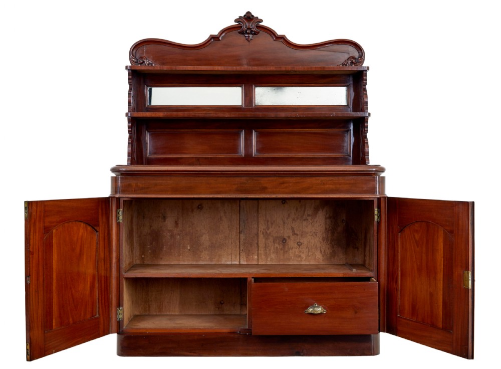 A 19th-century French mahogany chiffonier sideboard featuring a carved pediment upper tier with inset mirror panels over a two-door base cabinet. View II