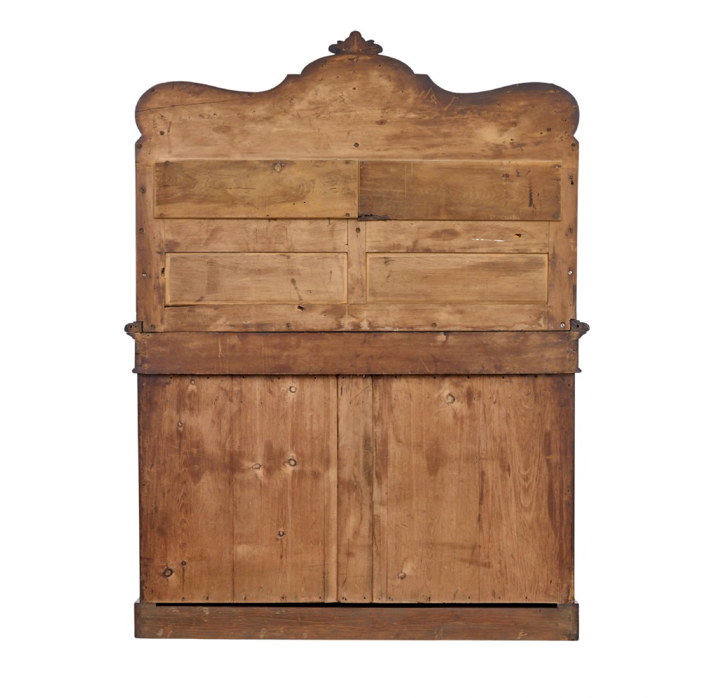 A 19th-century French mahogany chiffonier sideboard featuring a carved pediment upper tier with inset mirror panels over a two-door base cabinet. View V
