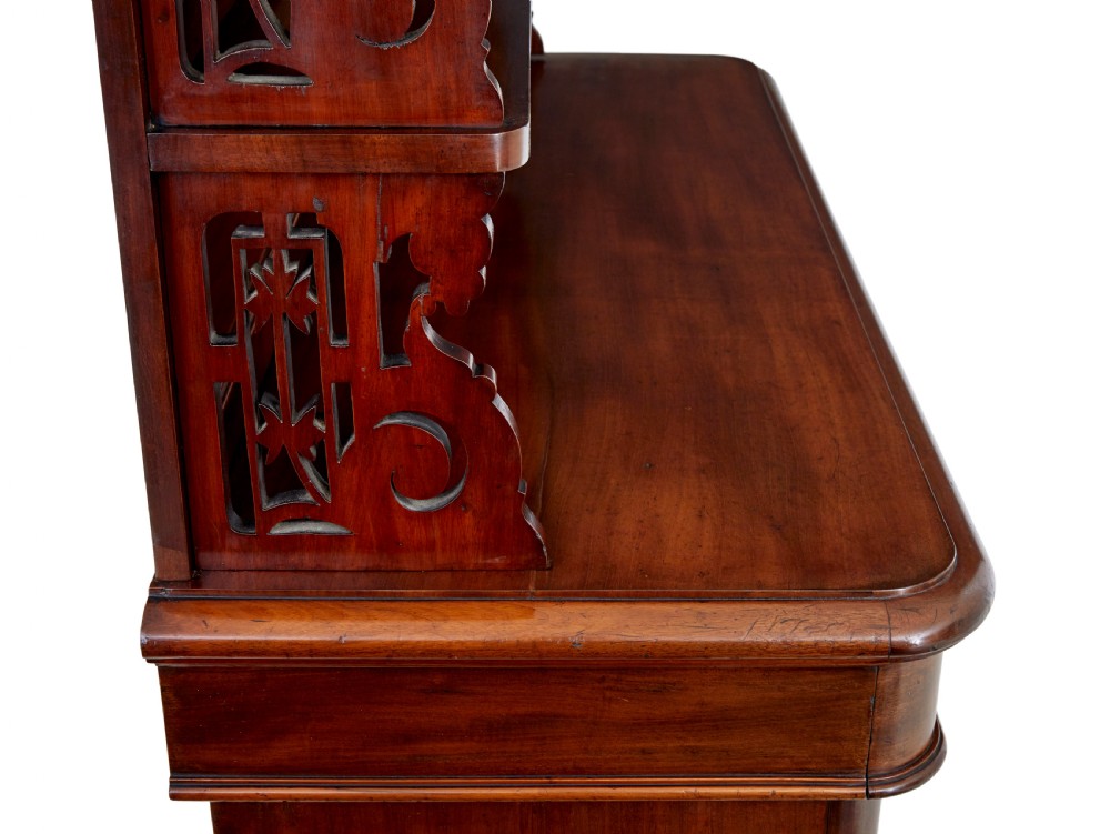 A 19th-century French mahogany chiffonier sideboard featuring a carved pediment upper tier with inset mirror panels over a two-door base cabinet. View VI