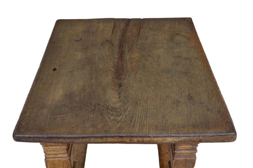 A 17th-century Flemish carved oak side table featuring a frieze drawer, turned legs, and a lower box stretcher. View V