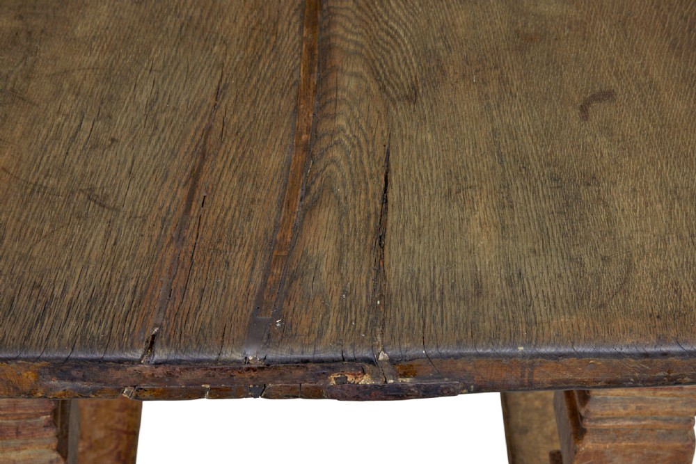 A 17th-century Flemish carved oak side table featuring a frieze drawer, turned legs, and a lower box stretcher. View VI