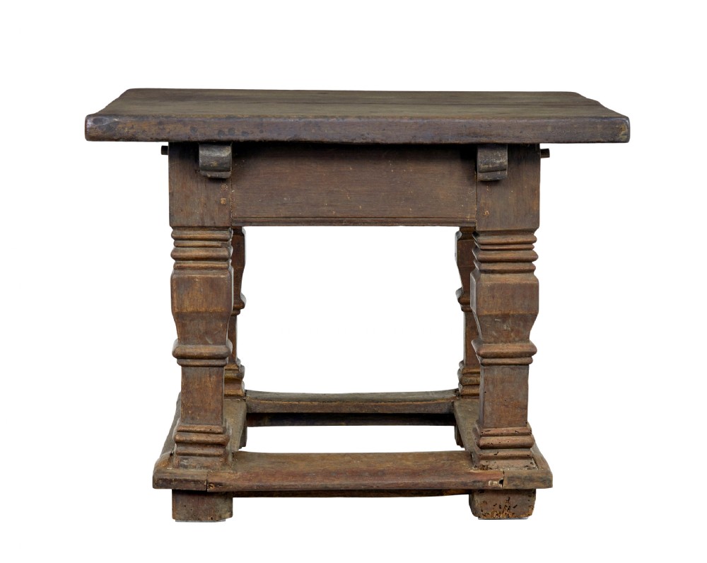 A 17th-century Flemish carved oak side table featuring a frieze drawer, turned legs, and a lower box stretcher. View X