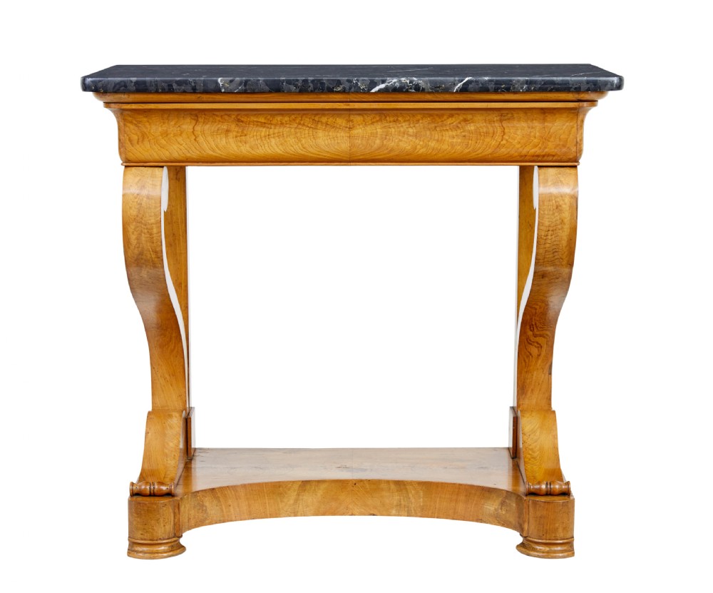 A mid-19th century Swedish console table made from light-coloured elm wood with a black marble top and curved s-scroll legs. View II