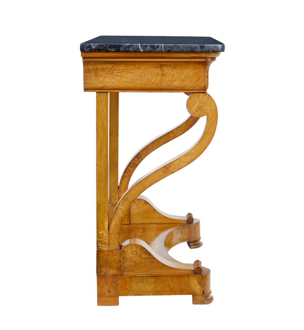 A mid-19th century Swedish console table made from light-coloured elm wood with a black marble top and curved s-scroll legs. View III