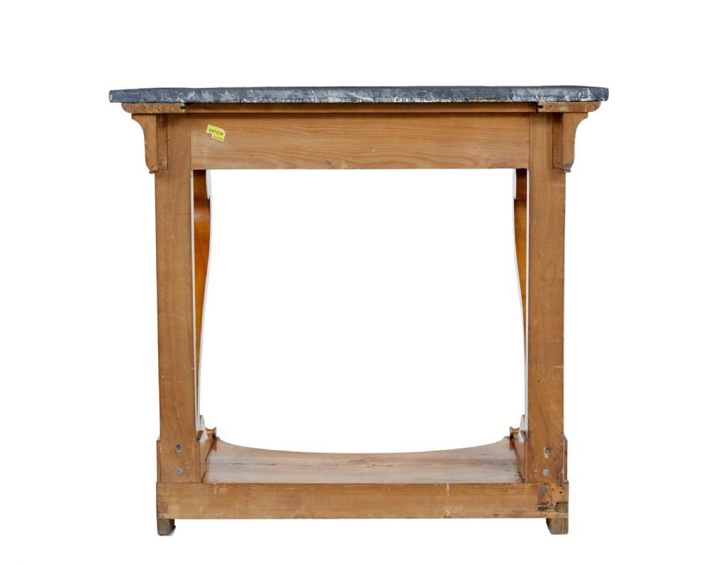 A mid-19th century Swedish console table made from light-coloured elm wood with a black marble top and curved s-scroll legs. View IV