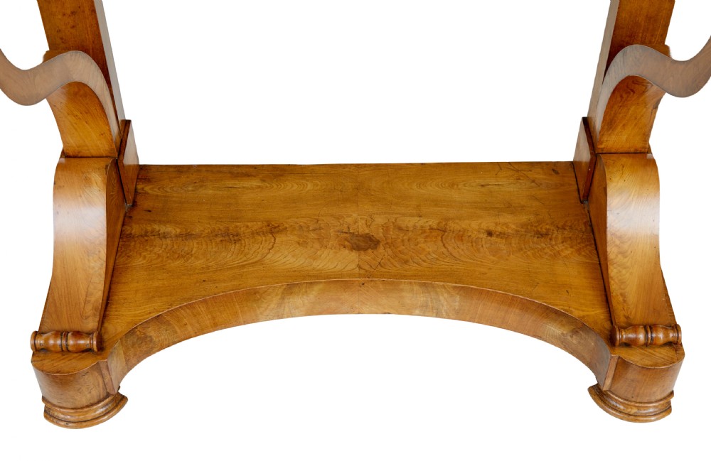 A mid-19th century Swedish console table made from light-coloured elm wood with a black marble top and curved s-scroll legs. View VI