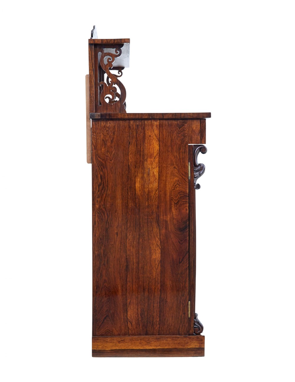 A nineteenth-century Regency palisander chiffonier sideboard with its two panelled doors open, revealing internal wooden shelves, topped with a carved scrollwork gallery shelf. View V