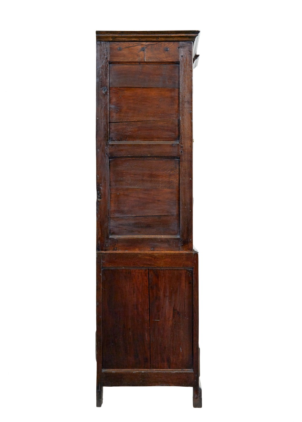An 18th-century dark oak housekeepers cupboard featuring arched fielded panel doors above a lower section fitted with drawers and brass handles. View IV