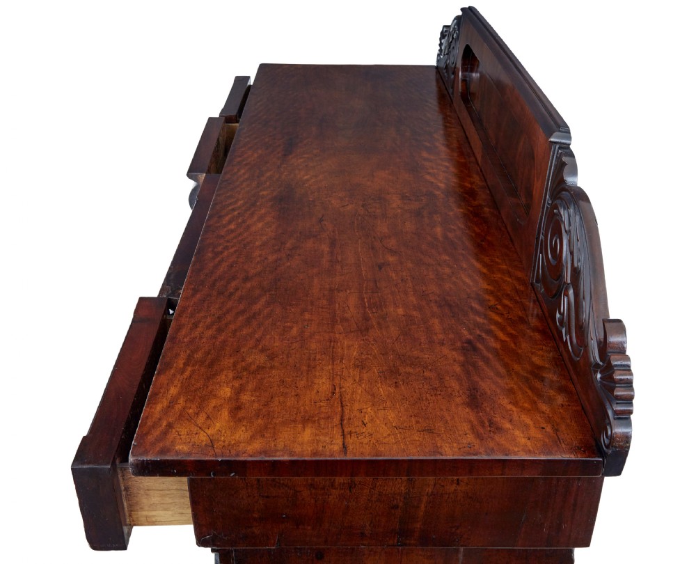 A nineteenth-century William IV mahogany pedestal sideboard featuring an architectural splashback with carved scrolls, frieze section, and two cupboard pedestals on plinth bases. View VII