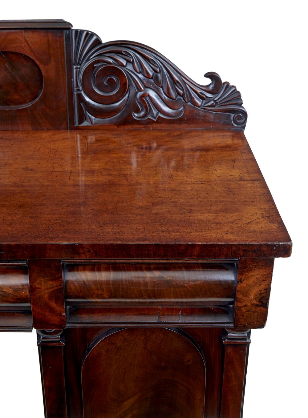 A nineteenth-century William IV mahogany pedestal sideboard featuring an architectural splashback with carved scrolls, frieze section, and two cupboard pedestals on plinth bases. View VIII