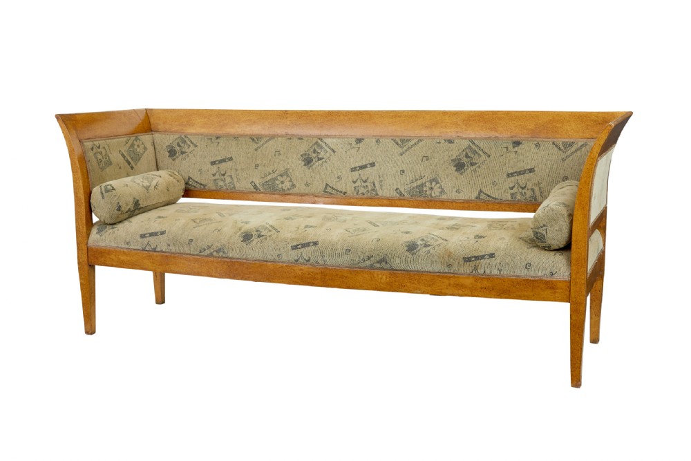 A seven-piece late nineteenth-century seating suite crafted from burr birch timber, including a high-backed sofa and six matching slat-back chairs with patterned fabric seats. View II