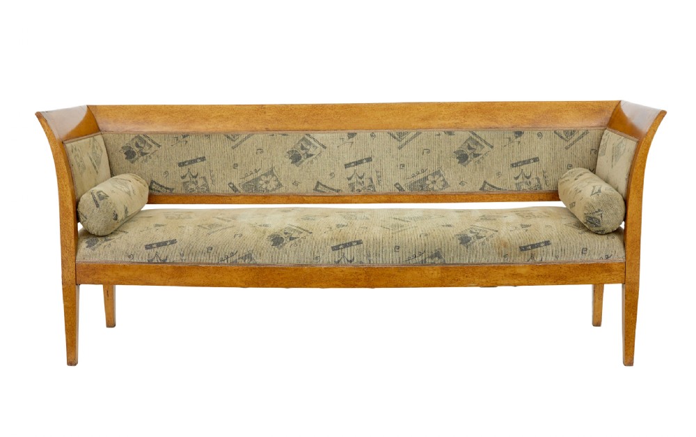 A seven-piece late nineteenth-century seating suite crafted from burr birch timber, including a high-backed sofa and six matching slat-back chairs with patterned fabric seats. View III