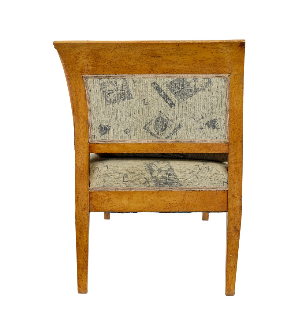 A seven-piece late nineteenth-century seating suite crafted from burr birch timber, including a high-backed sofa and six matching slat-back chairs with patterned fabric seats. View IV
