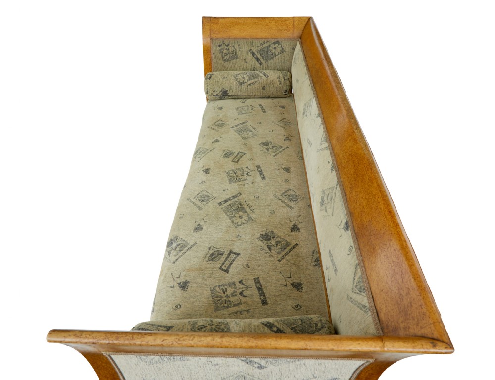 A seven-piece late nineteenth-century seating suite crafted from burr birch timber, including a high-backed sofa and six matching slat-back chairs with patterned fabric seats. View VII