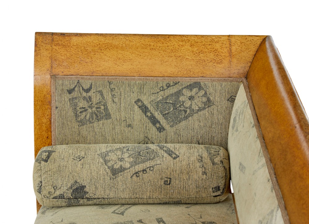A seven-piece late nineteenth-century seating suite crafted from burr birch timber, including a high-backed sofa and six matching slat-back chairs with patterned fabric seats. View VIII