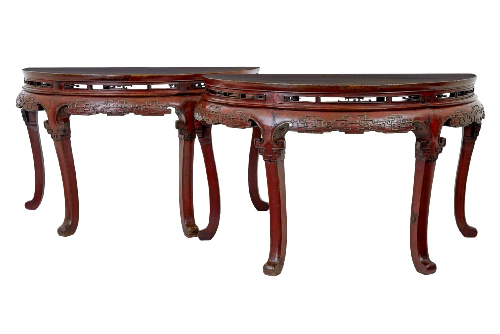 A pair of 19th-century Chinese red lacquer demi-lune tables joined together to form a circular table with carved key-fret aprons and cabriole legs. View III