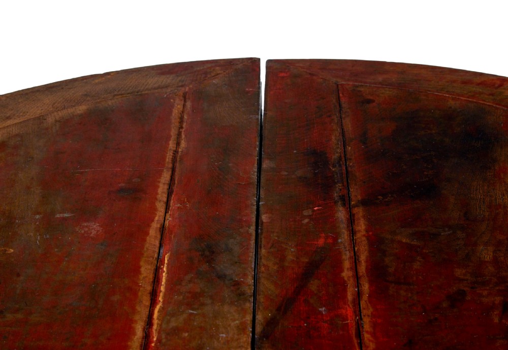 A pair of 19th-century Chinese red lacquer demi-lune tables joined together to form a circular table with carved key-fret aprons and cabriole legs. View VII