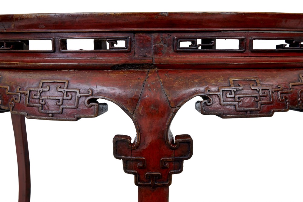 A pair of 19th-century Chinese red lacquer demi-lune tables joined together to form a circular table with carved key-fret aprons and cabriole legs. View VIII