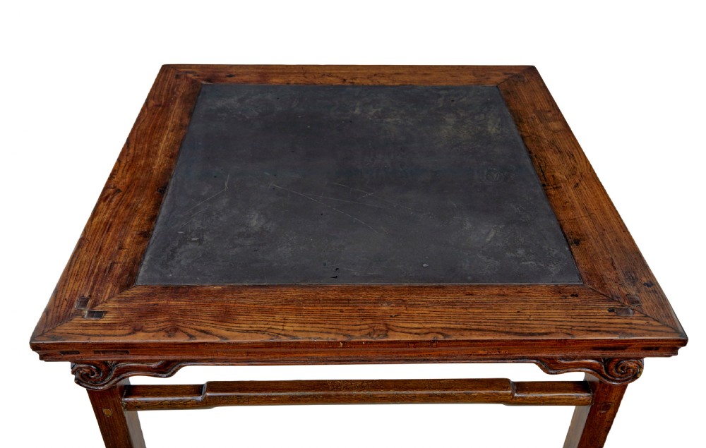 A 19th-century square Chinese hardwood centre table with an inset dark marble top, carved scroll spandrels, and humpback stretchers. View III