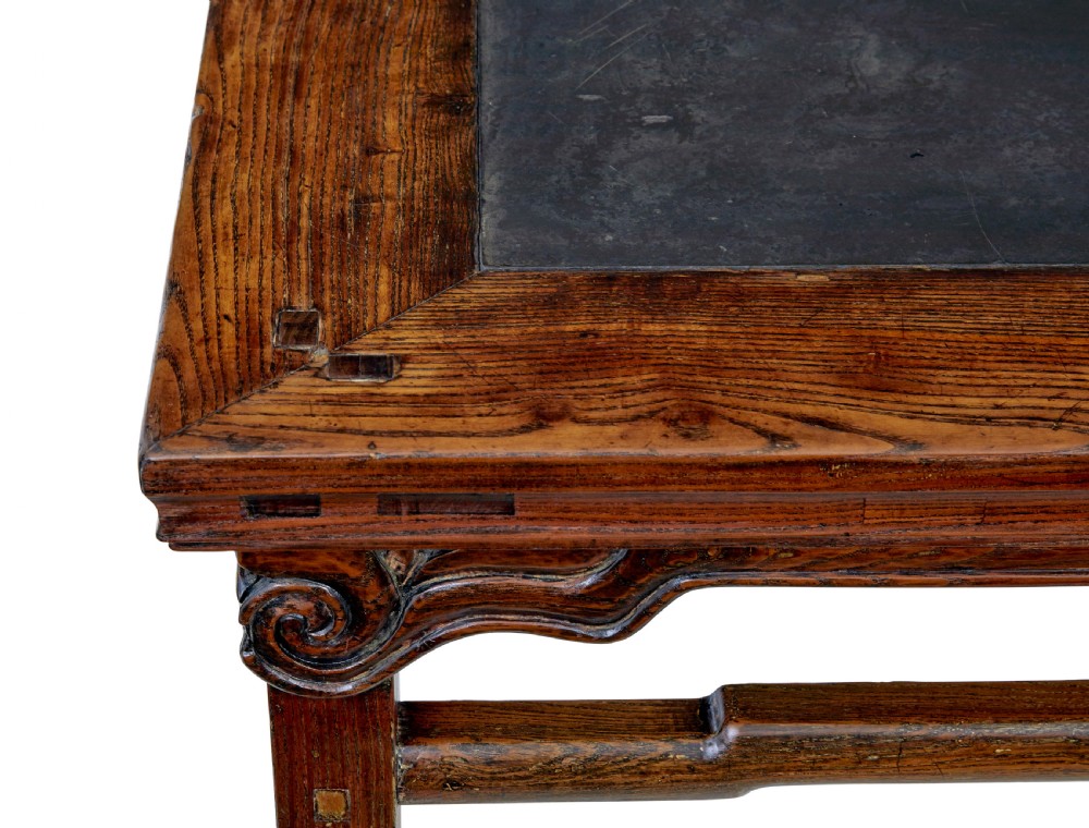 A 19th-century square Chinese hardwood centre table with an inset dark marble top, carved scroll spandrels, and humpback stretchers. View IV