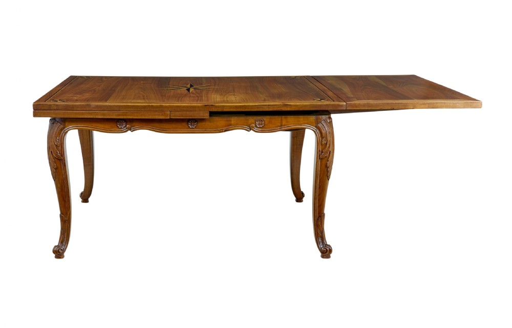 A 19th-century French fruitwood extending dining table with carved cabriole legs and a star inlay motif on the rectangular top. View III