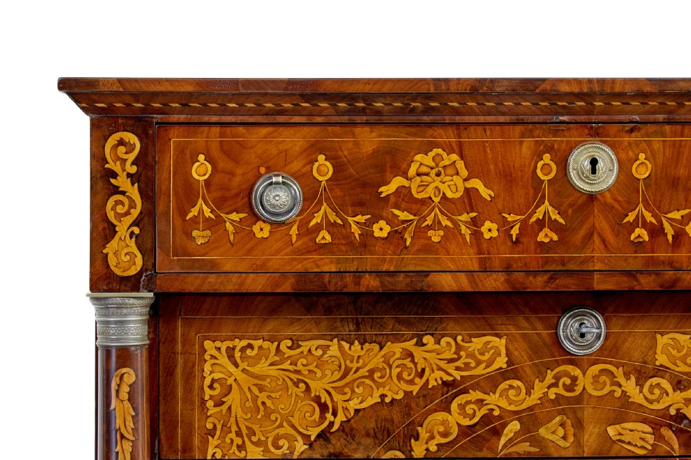 A 19th-century French mahogany chest of six drawers with detailed floral and bird fruitwood marquetry inlays and column sides. View X
