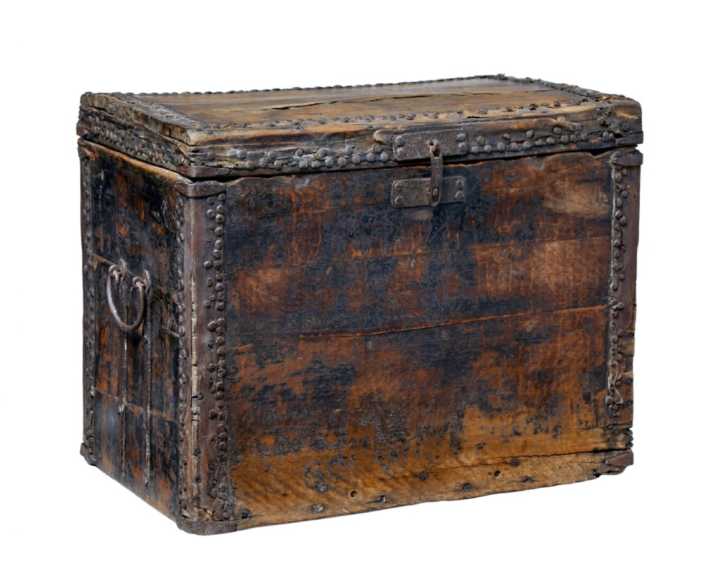 A dark brown 18th-century Chinese hardwood coffer chest with iron studding, metal corner bindings, a central latch, and side drop-handles.