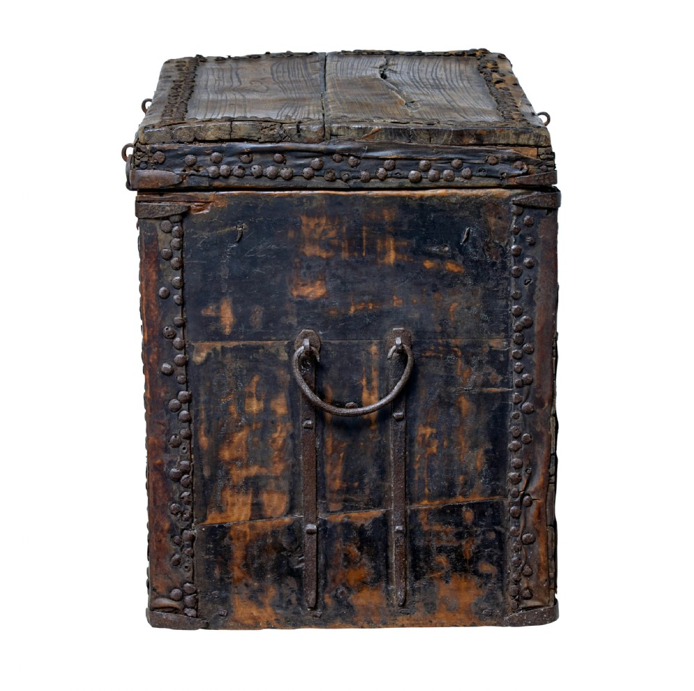 A dark brown 18th-century Chinese hardwood coffer chest with iron studding, metal corner bindings, a central latch, and side drop-handles. View III