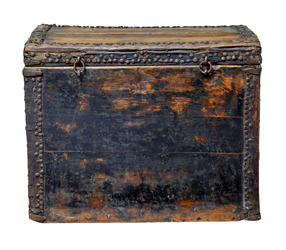 A dark brown 18th-century Chinese hardwood coffer chest with iron studding, metal corner bindings, a central latch, and side drop-handles. View IV