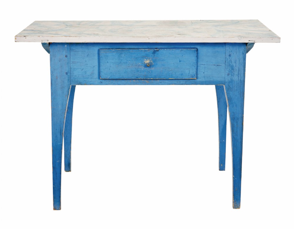 A 19th-century Swedish rustic side table with a blue painted frame, single frieze drawer, tapered square legs, and a worn white tabletop. View II