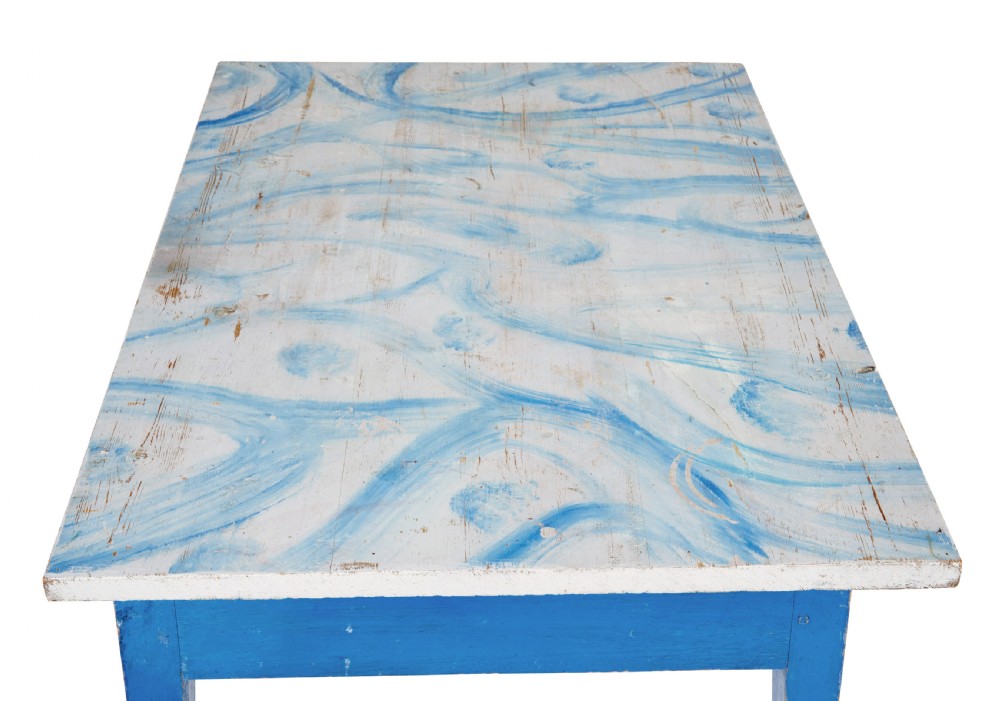 A 19th-century Swedish rustic side table with a blue painted frame, single frieze drawer, tapered square legs, and a worn white tabletop. View VI