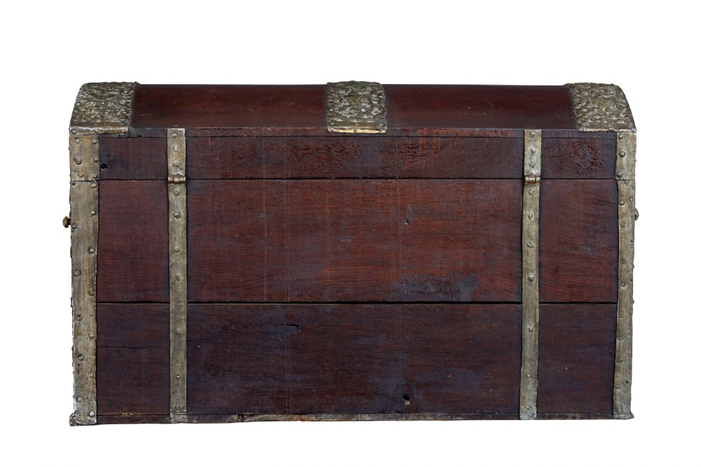 An 18th-century Danish dark oak dome-top coffer featuring intricate embossed brass straps, dual lock plates, and heavy side carrying handles. View IV