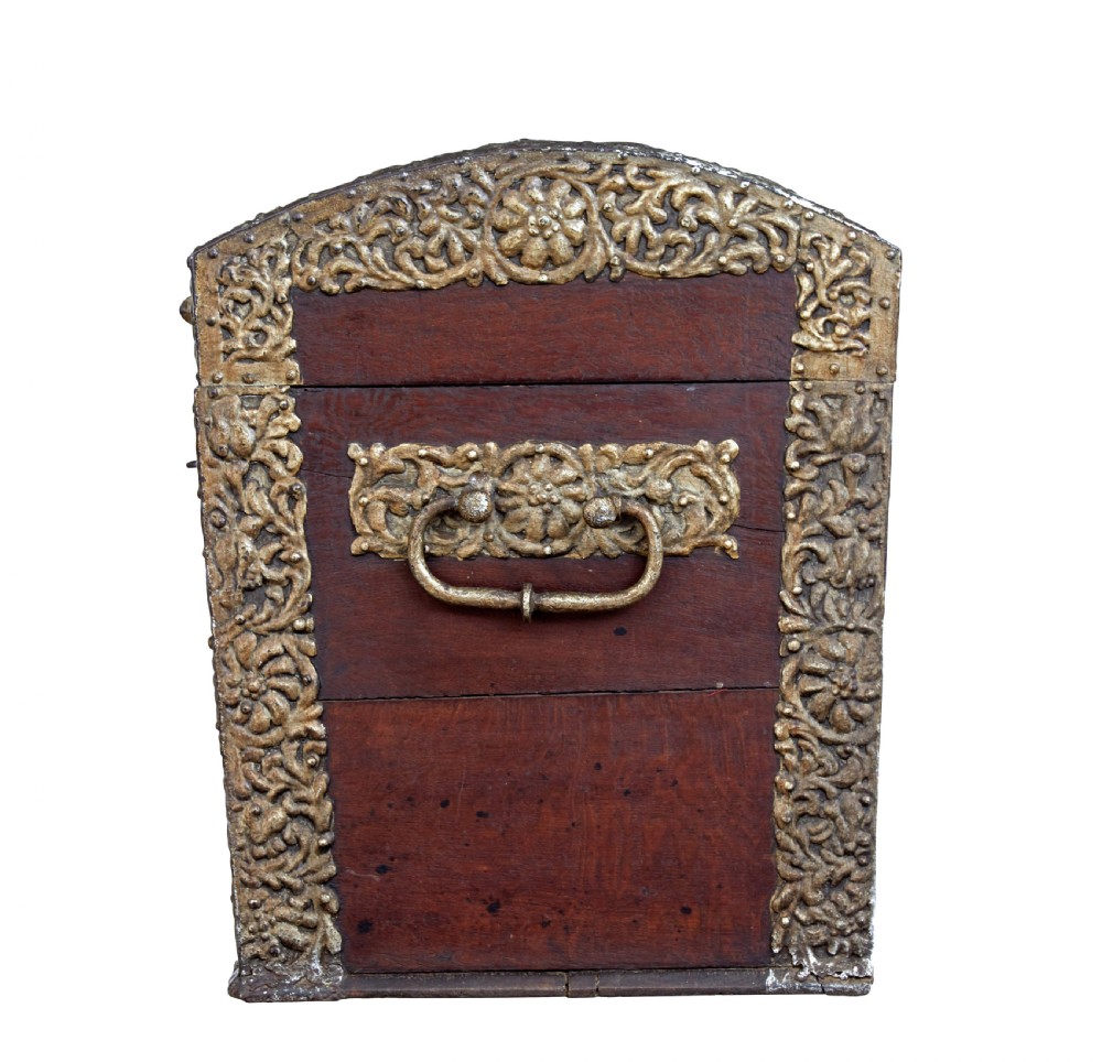 An 18th-century Danish dark oak dome-top coffer featuring intricate embossed brass straps, dual lock plates, and heavy side carrying handles. View VI