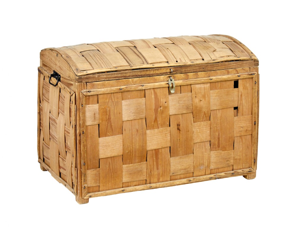 A late nineteenth-century Scandinavian trunk featuring woven pine strip construction, a domed lid, and iron side handles.