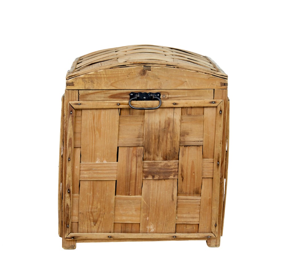 A late nineteenth-century Scandinavian trunk featuring woven pine strip construction, a domed lid, and iron side handles. View IV