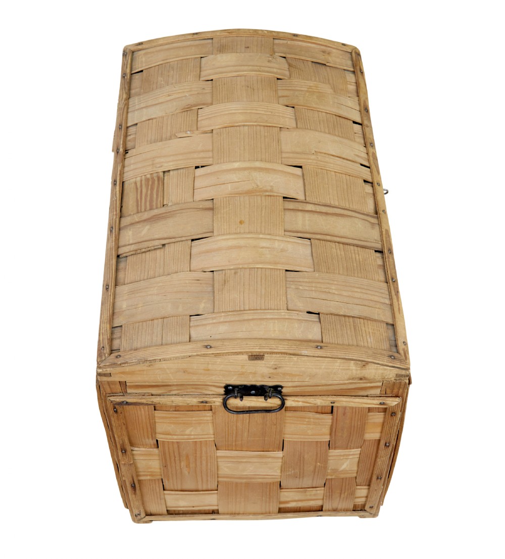 A late nineteenth-century Scandinavian trunk featuring woven pine strip construction, a domed lid, and iron side handles. View VII