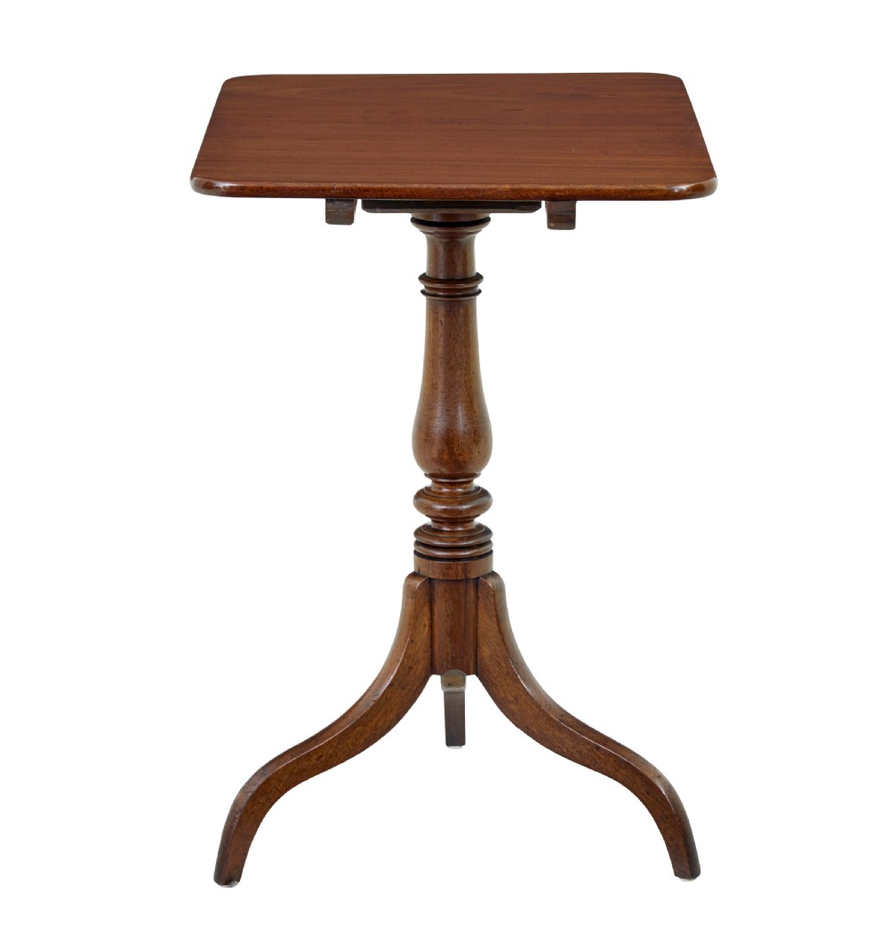 An early 19th-century mahogany tilt-top occasional table featuring a rectangular top, turned baluster stem, and three splayed legs. View II