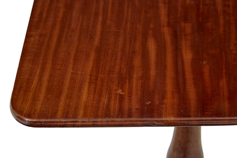 An early 19th-century mahogany tilt-top occasional table featuring a rectangular top, turned baluster stem, and three splayed legs. View VIII