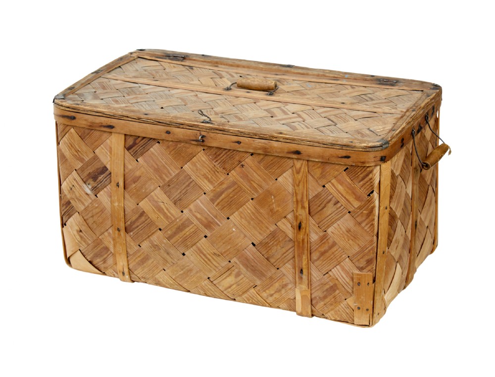 A 19th-century Swedish rectangular storage chest made from woven pine splints with a fitted hinged lid and wooden side handles.