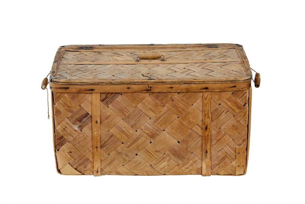 A 19th-century Swedish rectangular storage chest made from woven pine splints with a fitted hinged lid and wooden side handles. View VI